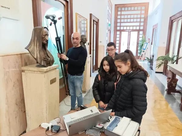 A middle school teacher uses a 3D scanner to help students understand the history